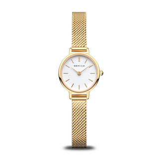 A polished gold Bering ladies classic watch with a white dial and a mesh band.