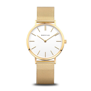 Gold watch with a white face on a white background
