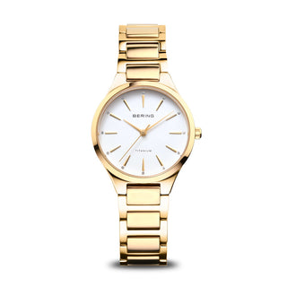 Gold wristwatch with white dial on a white background