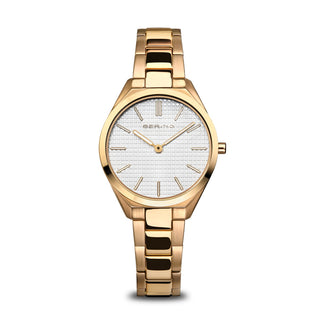Gold wristwatch with a white face on a white background