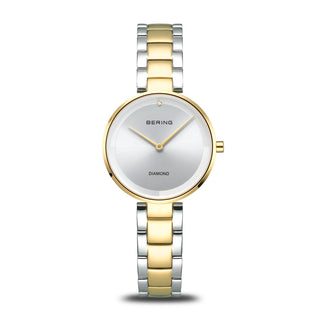Two-tone watch with gold and silver band on a white background