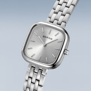 Silver Bering watch with a light gray background