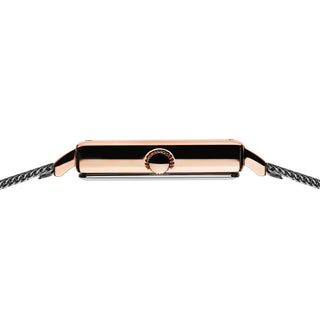 Rose gold and black bracelet on a white background