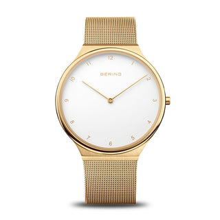 Gold watch with a white face on a white background