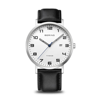 Bering watch with black leather strap and white dial on a white background