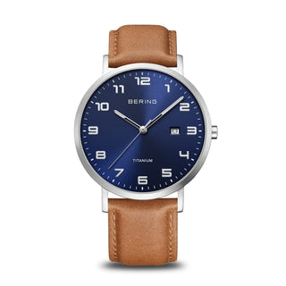 brown strap watch with a navy blue dial
