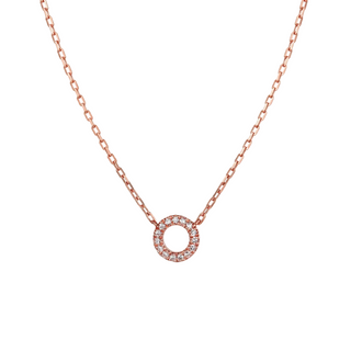 Rose gold necklace with a circular pendant on a light gray background