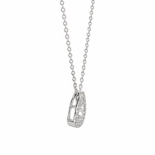 A silver-toned necklace with a teardrop-shaped pendant featuring a pavé-set clear gemstone, shown against a plain white background.