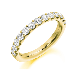 Gold ring with diamonds on a white background