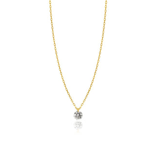 Gold necklace with a small round pendant on a white background