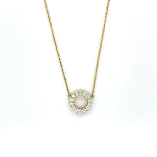 Gold necklace with a heart-shaped pendant on a white background