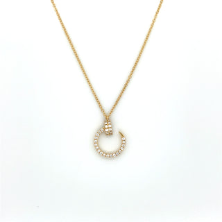 Gold necklace with a unique pendant on a white background