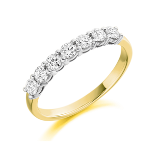 Gold ring with diamonds on a white background