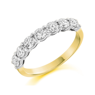 Gold and silver ring with diamonds on a white background