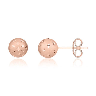 Rose gold ball earrings on a white background