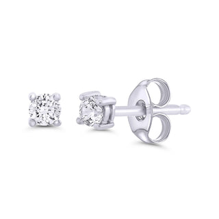 Pair of diamond stud earrings on a white background