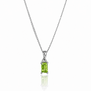 white gold necklace with a green pendant on a white background