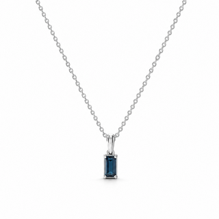 Silver necklace with a blue gemstone pendant on a white background