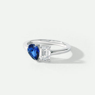 Silver ring with a blue gemstone on a white background