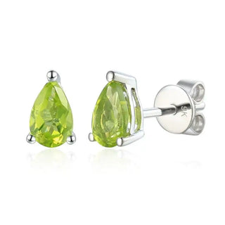 A pair of 9ct white gold stud earrings with pear-shaped peridot gemstones.