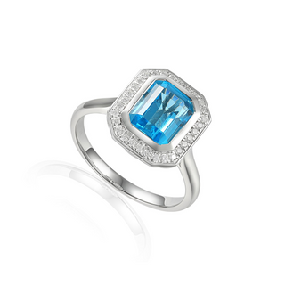 A 9ct white gold ring featuring an octagonal blue topaz centerpiece with a halo of brilliant-cut diamonds around it.