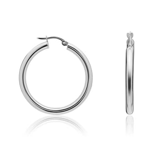 Silver hoop earrings on a white background