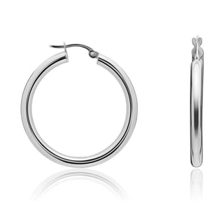 White gold hoop earrings on a white background