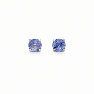Pair of blue gemstone stud earrings on a white background