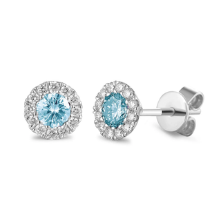 Pair of white earrings with blue gemstones on a white backgroundold 