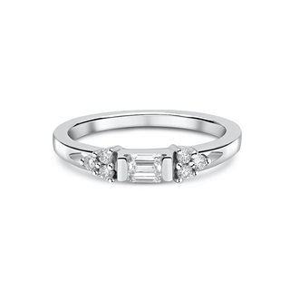 A 9ct white gold ring featuring a horizontal emerald-cut laboratory-grown diamond centerpiece, with three round brilliant-cut diamonds on each side, set in a white gold band.