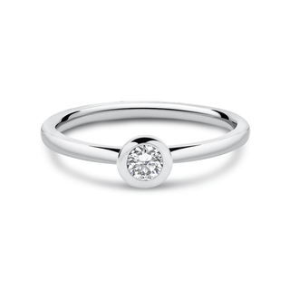 A white gold lab-grown diamond ring with a round brilliant cut diamond centerpiece, featuring a polished finish and a raised bezel setting.