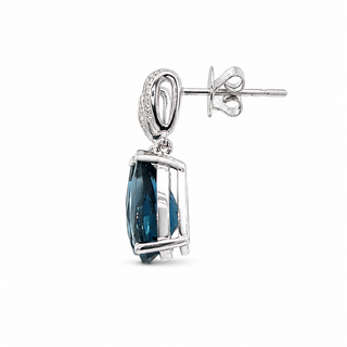 A single drop stud earring featuring a marquise-cut dark blue gemstone in a polished silver-toned bezel setting, with a decorative silver bail and post on a plain white background.