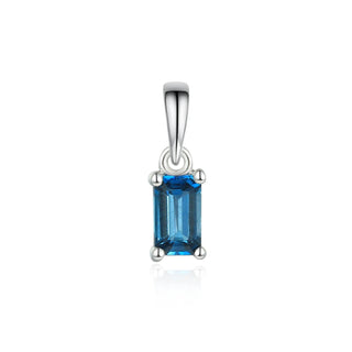 Silver pendant with a blue gemstone on a white background