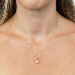 Pearl necklace on a person's neck