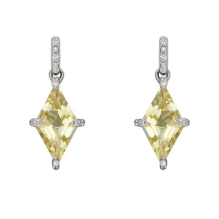 Pair of yellow diamond earrings with silver settings on a white background