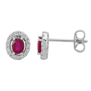 Silver earrings with red gemstones on a white background