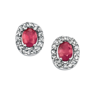 Pair of earrings with red gemstones and silver accents on a white background