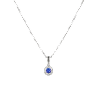Silver necklace with a blue gemstone pendant on a white background