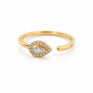 Gold ring with a diamond eye design on a white background