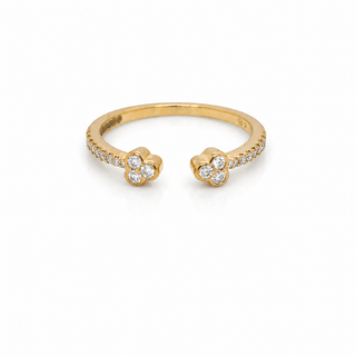 Gold ring with diamond accents on a white background