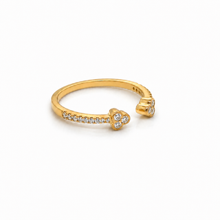 Gold ring with small diamonds on a white background