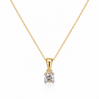 A delicate yellow gold chain necklace with a small gold pendant holding a clear gemstone, displayed on a clean white background.