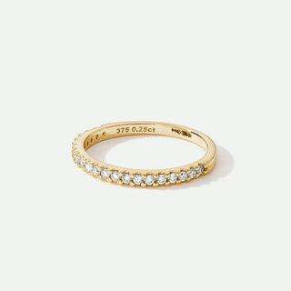 Gold ring with diamonds on a white background