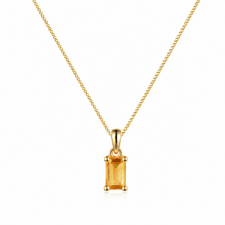 Gold necklace with a rectangular citrine pendant on a white background