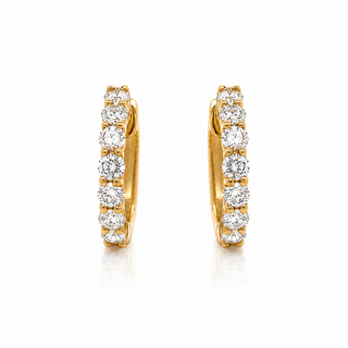 Gold hoop earrings with clear gemstones on a white background