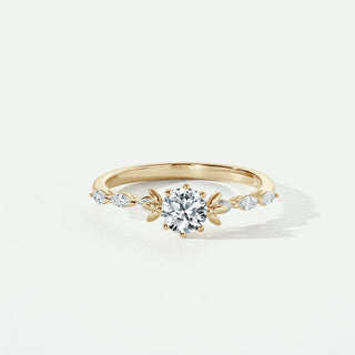 Gold ring with a diamond on a white background