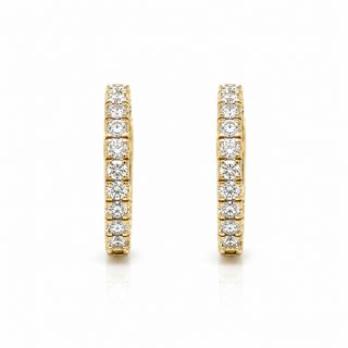 A pair of gold huggie hoop earrings set with round-cut diamond gemstones, shown against a plain white background.