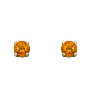 Pair of round orange gemstone earrings on a white background