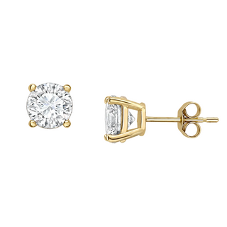 A pair of yellow gold stud earrings on a clean white background, showing both the front view of a round-cut diamond and the side profile of a rectangular baguette-cut diamond with its post and butterfly back.