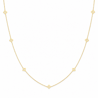 A delicate gold chain necklace featuring seven small, evenly spaced four-petal flower motifs, displayed on a clean white background.